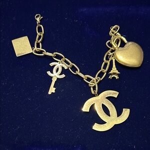CHANEL Gold Charm Bracelet with Iconic Symbols